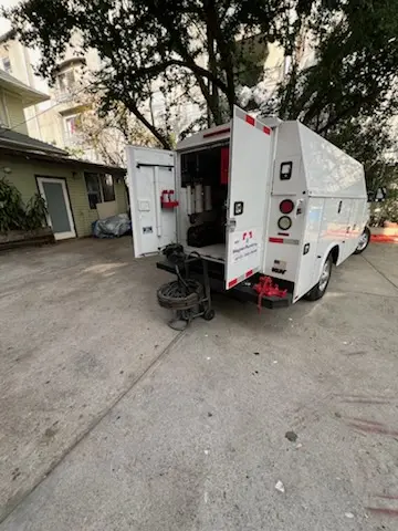 Magnet Plumbing service vehicle on-site for Grease Trap Cleaning in West Miami